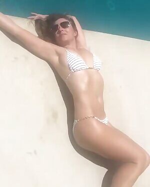 Just imagine being the pool boy while Elizabeth Hurley wiggles and squirms in front of you.