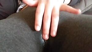 Rubbing and squirting through her leggings