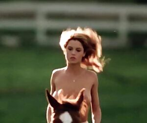 Betsy Russell riding a horse in Private School