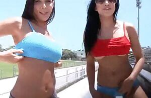 Brunette babes showing off their boobs in public