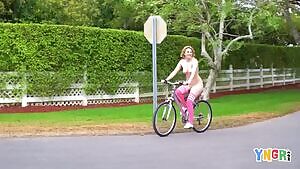 Big titted Kinsley Anne rides a bike naked in the middle of the street