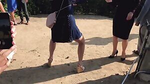 How Gina Darling stands when she takes a photo of someone