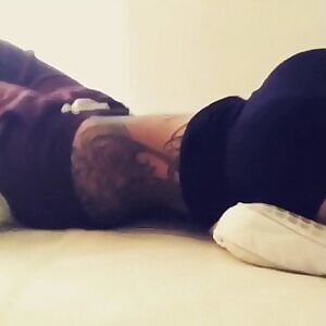 Sexy doll lying on bed